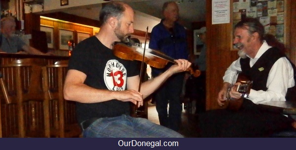 Tour Guide John Joe Sings A Ballad Accompanied By A Fiddler In John The Miner's Pub