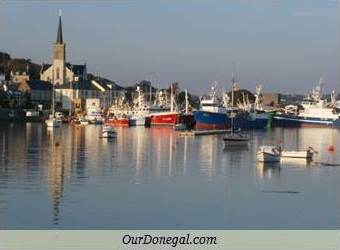 Fishing Boats And St. Mary's Church Reflected In Killybegs Harbour, Donegal, Ireland